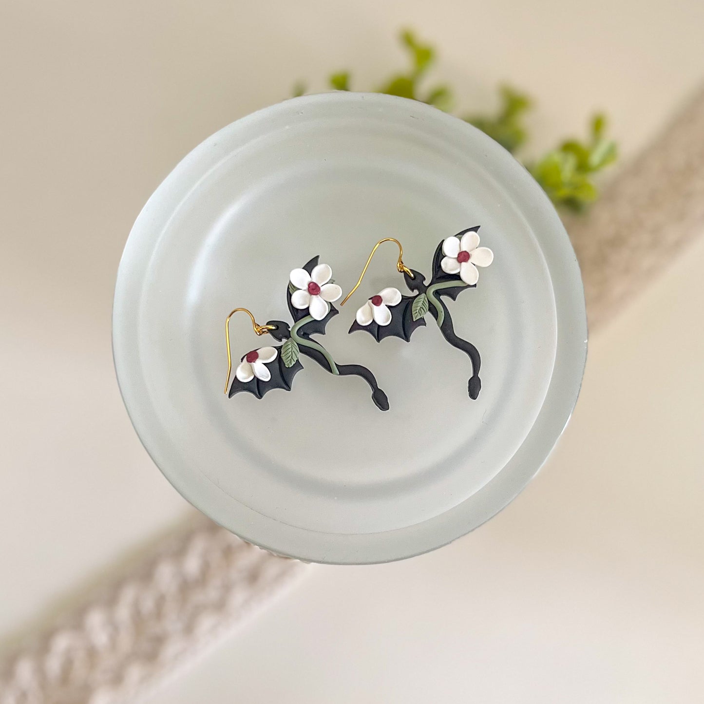 Black dragon earring with white floral details | 18k gold plated