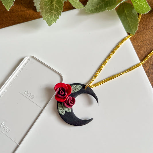 Black moon necklace with red flowers