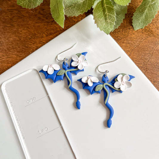 Blue dragon earring with white floral details | sterling silver