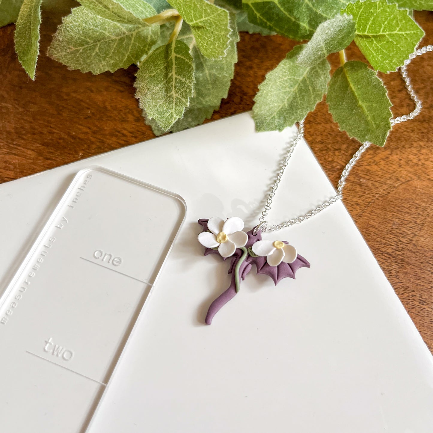Small purple dragon necklace with white floral details | 18" chain