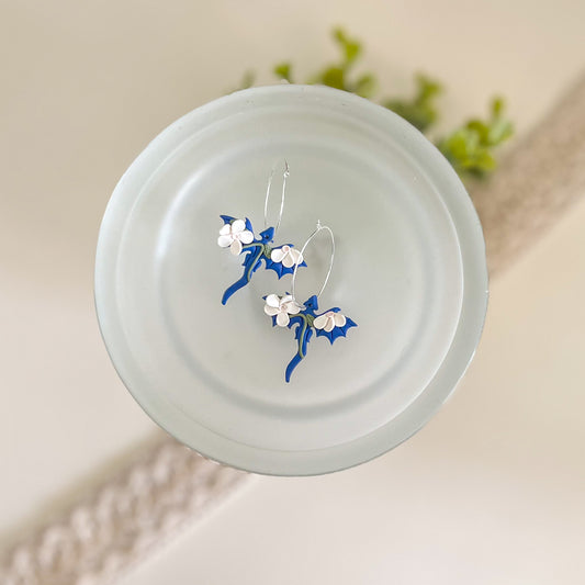 Small blue dragon hoop with white floral details | silver plated