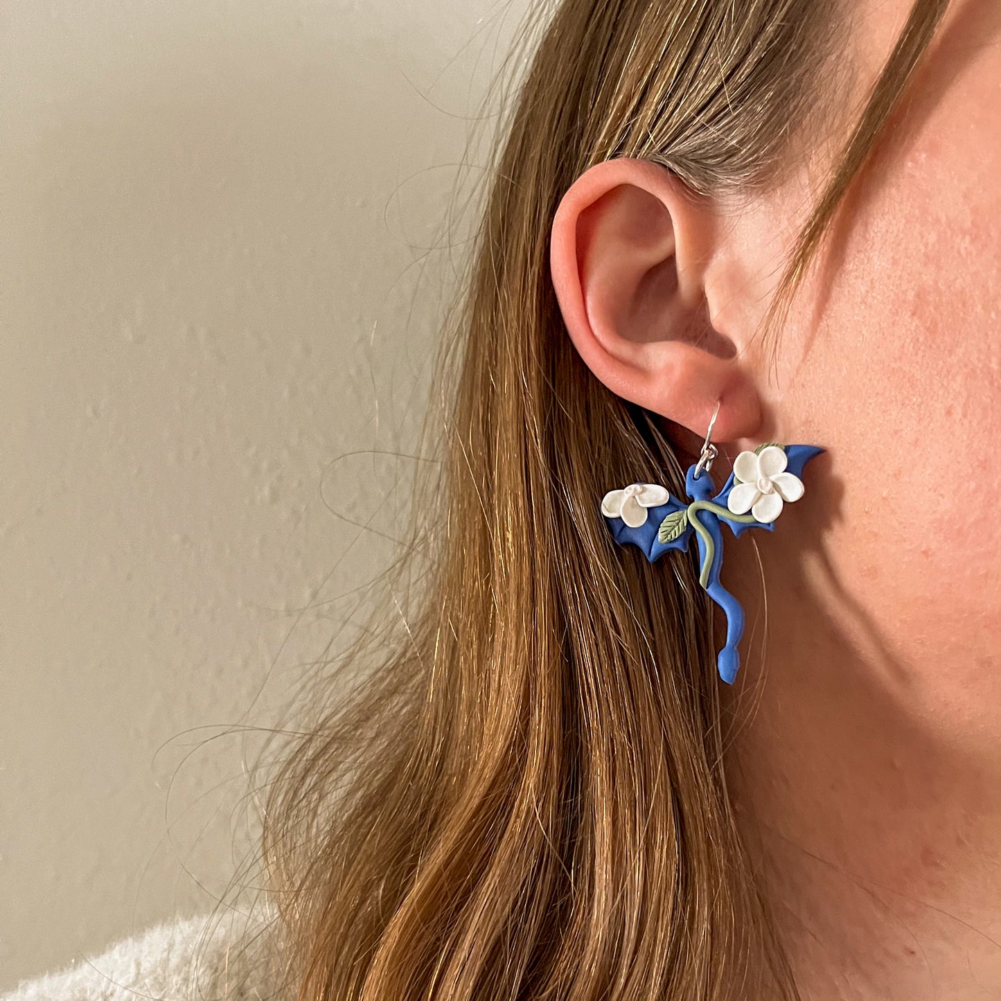Blue dragon earring with white floral details | sterling silver