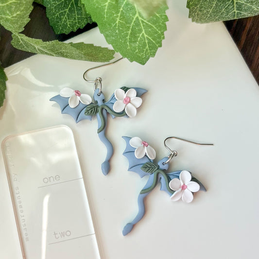 Sky blue dragon earring with white floral details | sterling silver