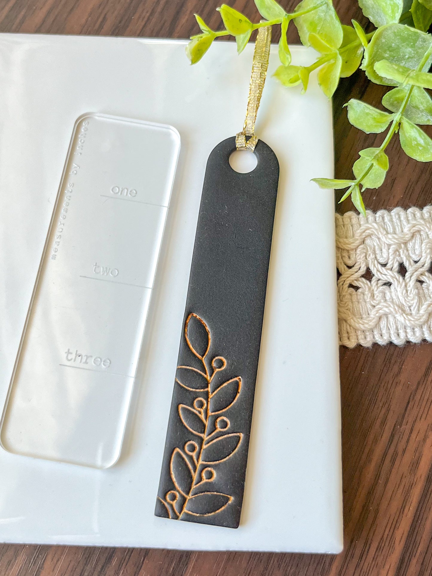 Black and gold embossed bookmark