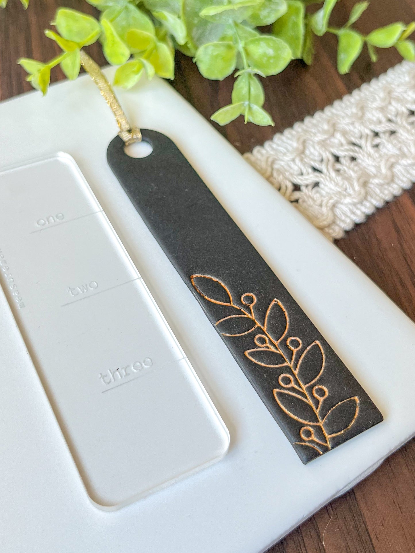 Black and gold embossed bookmark