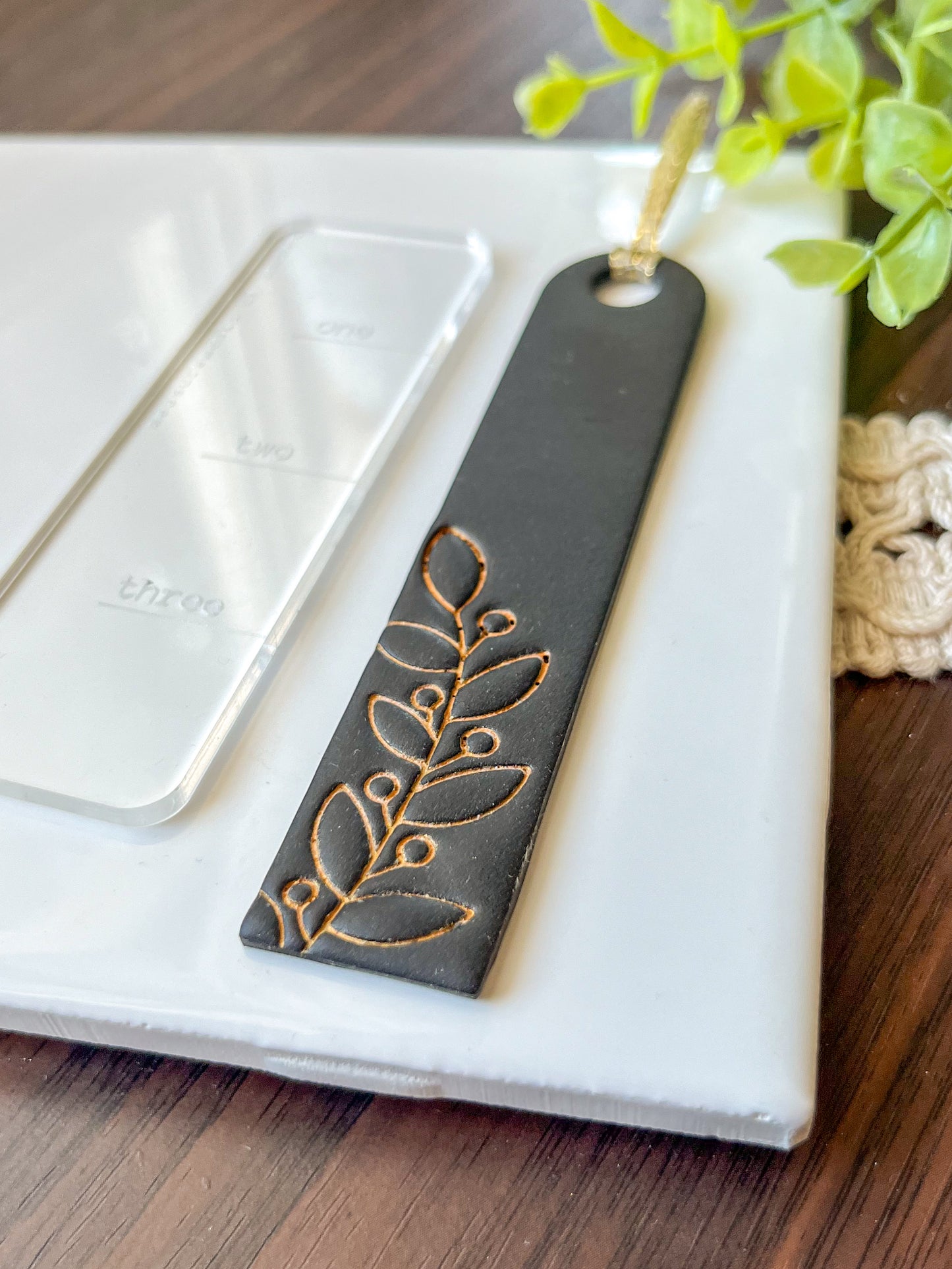 Black and gold embossed bookmark