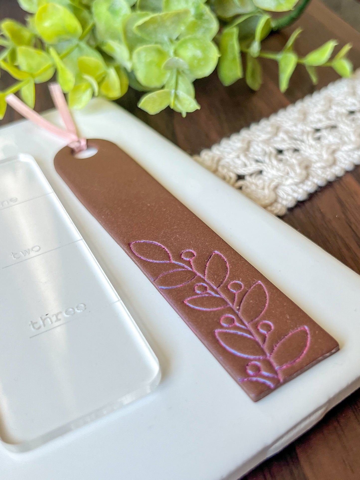 Brown and pink embossed bookmark