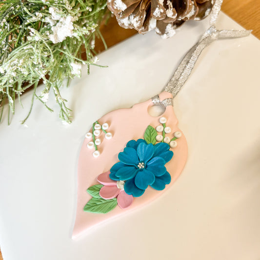 Pink and teal floral ornament