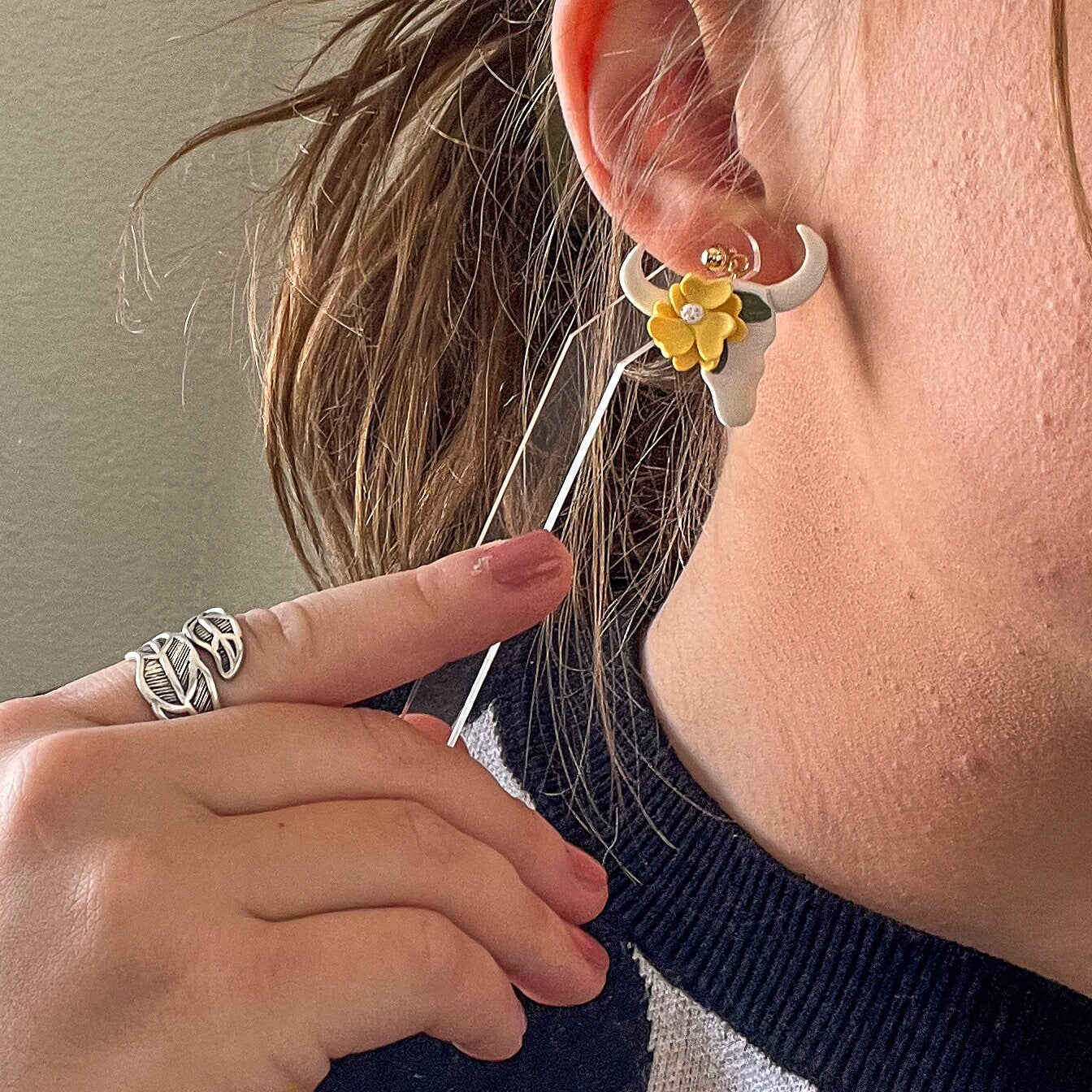 Yellow flower on a cow skull earrings | 24k gold plated